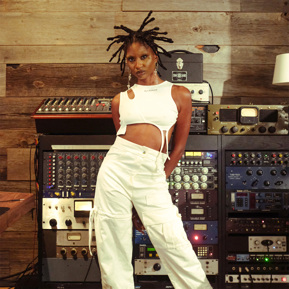 picture of girl wearing cream asymmetrical tank